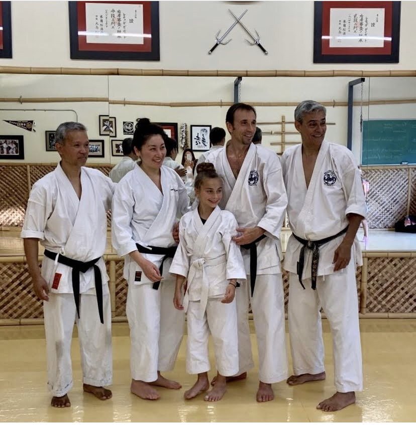 Group photo with fellow black belts at a Shotokan Karate of America (SKA) dojo